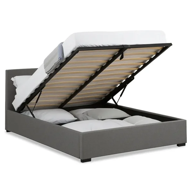 Grey upholstered ottoman bed frame with slatted base on a white background.