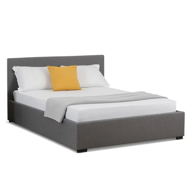 Grey upholstered ottoman bed frame with slatted base on a white background.