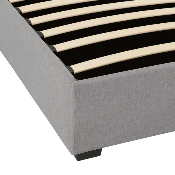 Grey upholstered ottoman bed frame with slatted base on a white background.